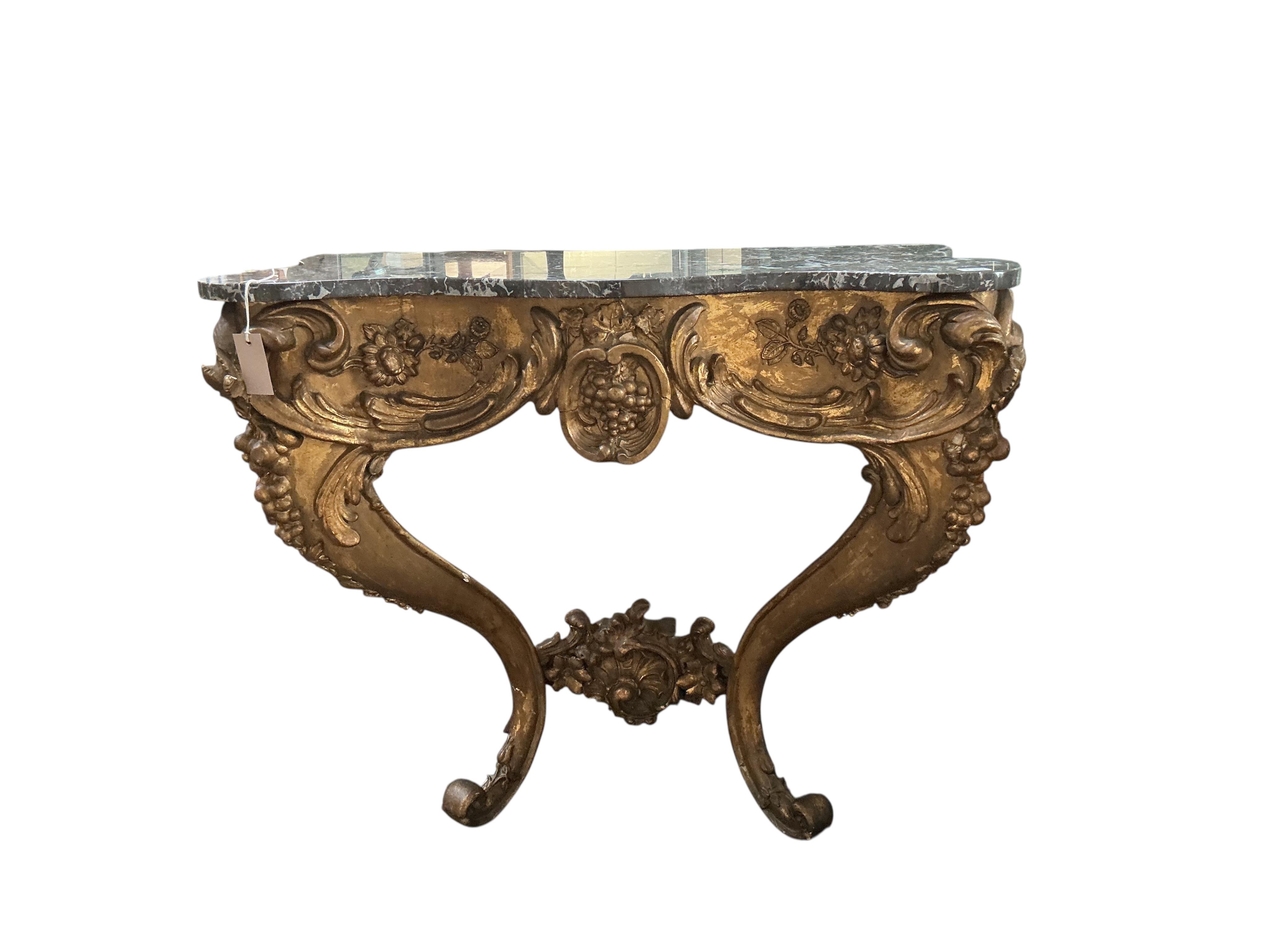 An 18th century Italian carved giltwood serpentine console table with associated marble top, width 85cm, depth 50cm, height 95cm